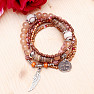 A set of five unisex fashion bracelets in a brown tone