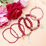 A set of five unisex fashion bracelets in a red tone