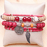 A set of five unisex fashion bracelets in a red tone