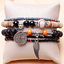 A set of five fashionable bracelets in a unisex black tone