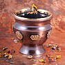 Metal brown bowl in the shape of a cup with chakra symbols