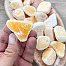 Calcite orange pebble with burr