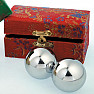 Medical Chinese meditation balls against silver color stress