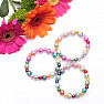 Children&#39;s bracelet made of colorful acrylic beads with glittering beads