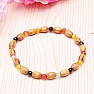 Bracelet made of wooden beads with colored agate beads