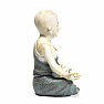 Buddhist monk statuette of a boy in gray robes colored