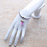 Children&#39;s bracelet made of lilac glass beads with an angel