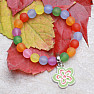 Children's bracelet with colored beads and a flower