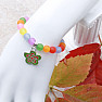 Children's bracelet with colored beads and a flower