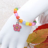 Children's bracelet with colored beads and a flower