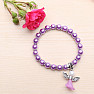 Children&#39;s bracelet made of purple glass beads with an angel