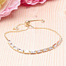 Glittering gold-plated bracelet with white cubic zirconia