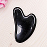 Gua sha made of black obsidian heart shape