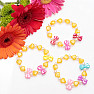 Children&#39;s bracelet made of hearts with yellow bows