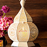 Oriental metal candlestick magic lantern on big candles