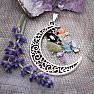 Moon pendant with semi-precious stones in the colors of the chakras