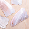 Gua sha made of mussel fin shape