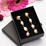 Hanging earrings with four pearls