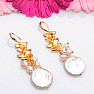 Fashionable earrings with a large keshi pearl and freshwater pearls