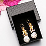 Fashionable earrings with a large keshi pearl and freshwater pearls