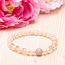 Attractive bracelet made of peach-colored pearls RB Design 167