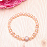 Attractive bracelet made of peach-colored pearls RB Design 167