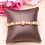 Attractive bracelet made of peach-colored pearls RB Design 167