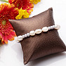 Glittering bracelet made of large white pearls and cut glass beads