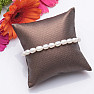 Women's pearl bracelet made of white pearls in the shape of ovals