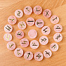 A set of runestones made of Rose quartz