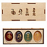 Reiki set of stones with Reiki symbols in a wooden box