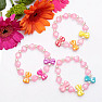 Children&#39;s bracelet made of pink hearts with bows