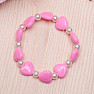 Children's bracelet made of dark pink hearts with pearls