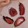 Agate pendant polished slice in a red metal frame