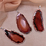 Agate pendant polished slice in a red metal frame