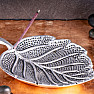 Incense holder silvery in the shape of a wide leaf