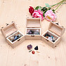 A wooden chest with a mix of stones