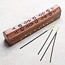 Chest and wood stand for incense sticks with flowers