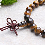 Tiger Eye Buddha had a Buddha head chakra bracelet