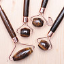 Tiger eye massage roller rose gold color