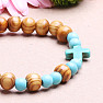 Bracelet made of wood and tyrkenite beads with a cross