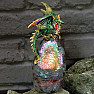 Statuette of a shining emerald dragon guardian