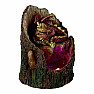 Statuette glowing Red dragon on a tree stump