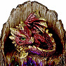 Statuette glowing Red dragon on a tree stump