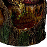 Statuette glowing Red dragon on a tree stump