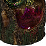 Statuette glowing Green dragon on a tree stump