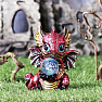 Statuette of a glowing red dragon with a oracle sphere