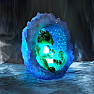 Statuette glowing Green dragon in a geode nest