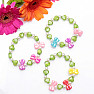 Children's bracelet made of hearts with green bows